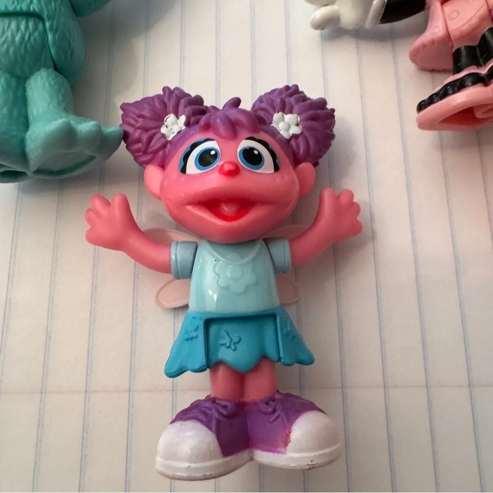 Colorful Sesame Street Neighborhood Friends and Minnie Mouse figurines